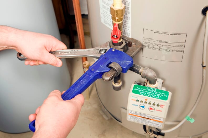 Plumber repairing a water heater valve in Pottstown